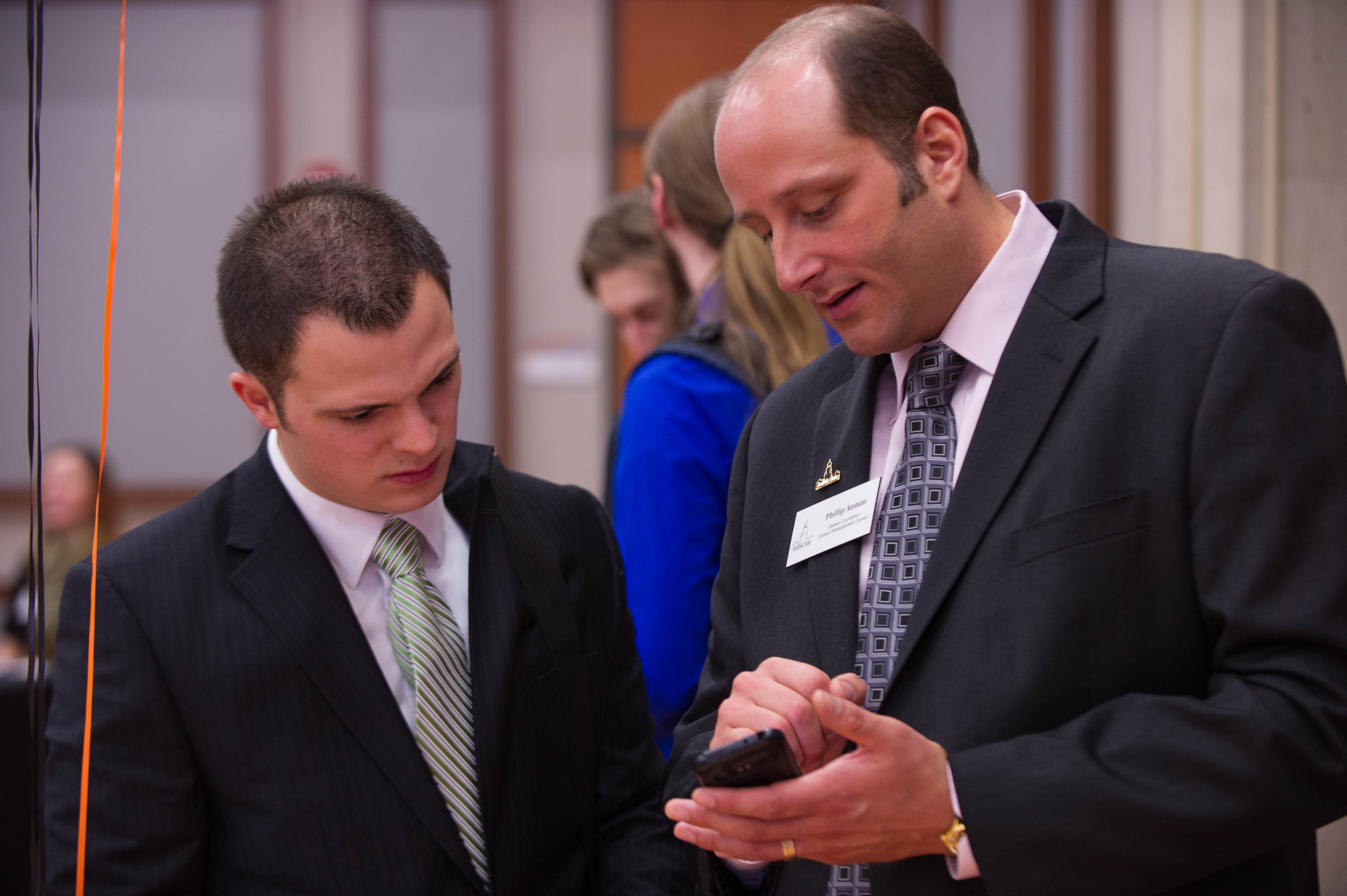 Phillip Auman engaging a student at Job Fair.